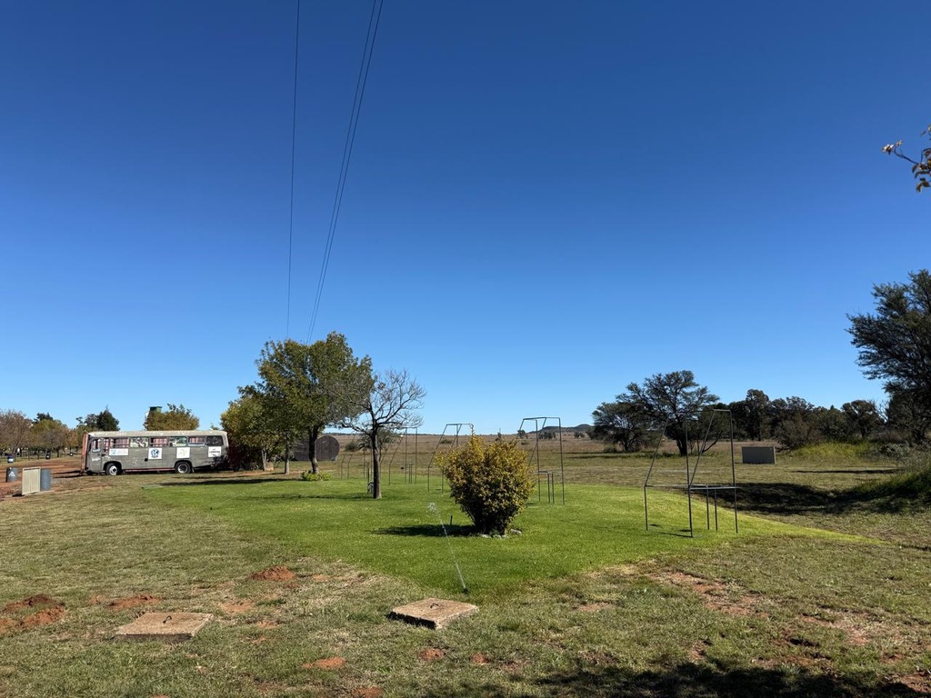 Compak SA hospitality bus and open range on a sunny day