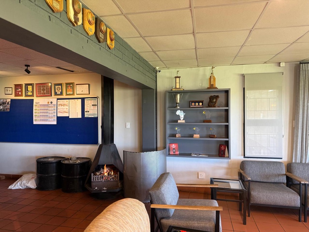Clubhouse trophy wall and fireplace lounge area