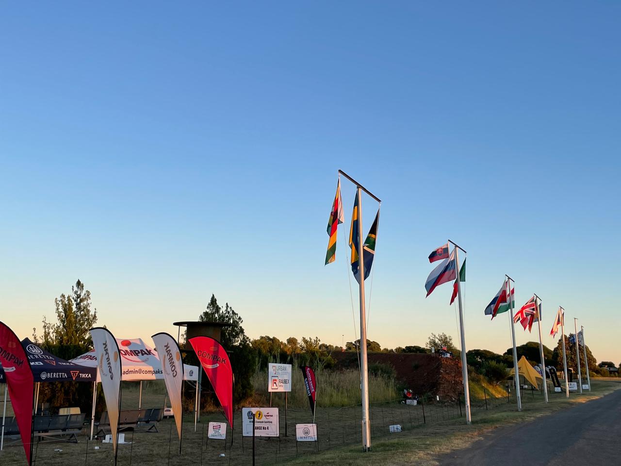 Avenue of flags and sponsor banners at Maccauw