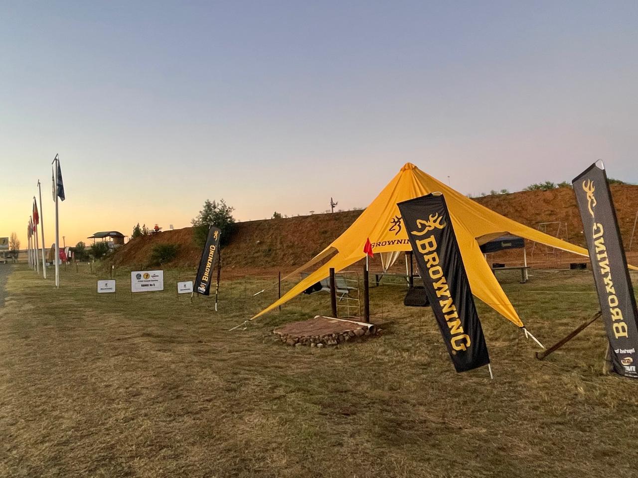 Browning tent and sponsor banners at dusk