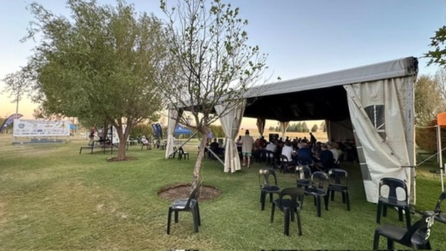 Competitors and guests gather under the marquee at Maccauw