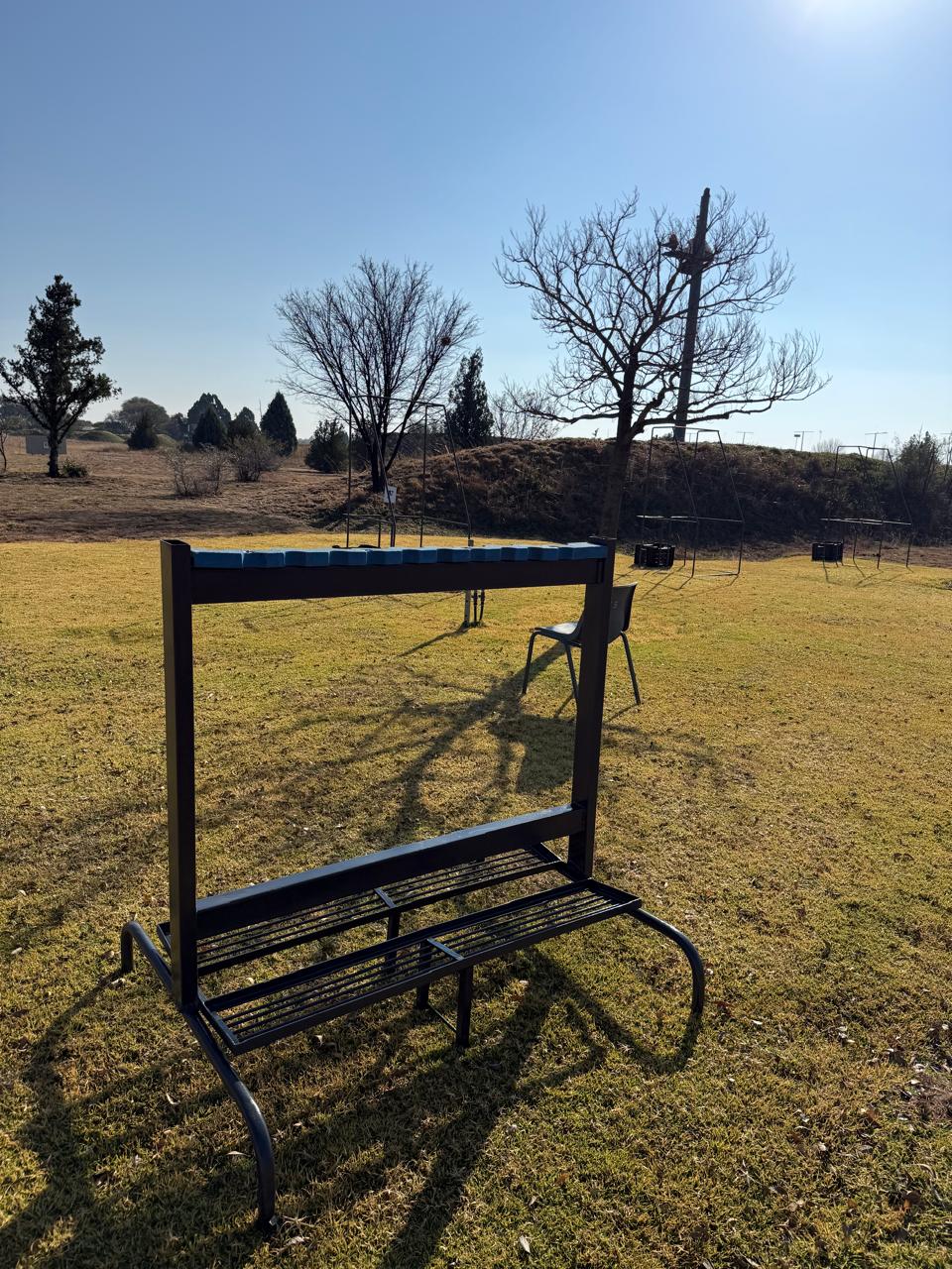 A custom bench and stand markers on the manicured range