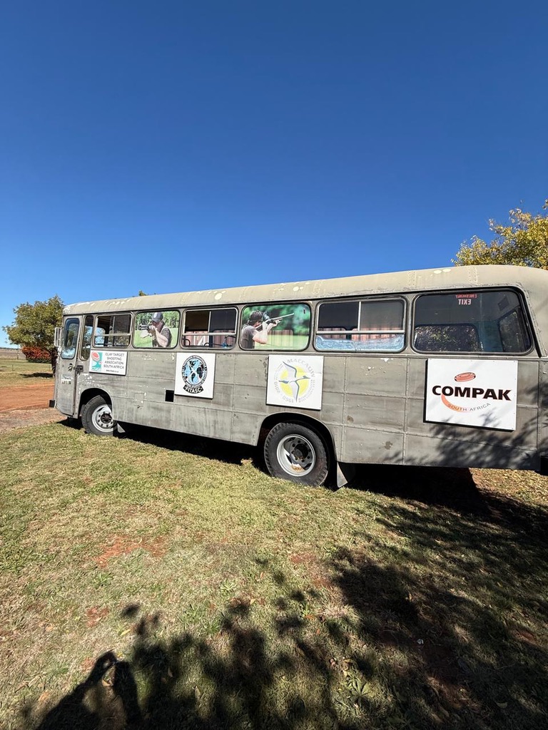 The Compak SA branded hospitality bus parked at the club