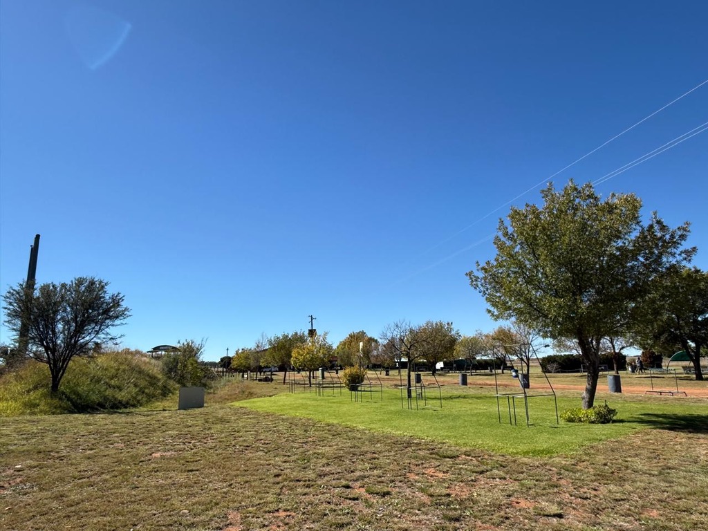 Open range landscape with stands spread across the grass